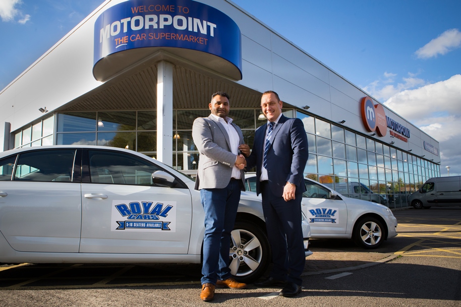 Imran Khan, left, from Royal Cars collects the keys to his 15 new car cars from Gavin Morgans, General Manager of Motorpoint in Birtley Imran Khan, left, from Royal Cars collects the keys to his 15 new car cars from Gavin Morgans, General Manager of Motorpoint in Birtley