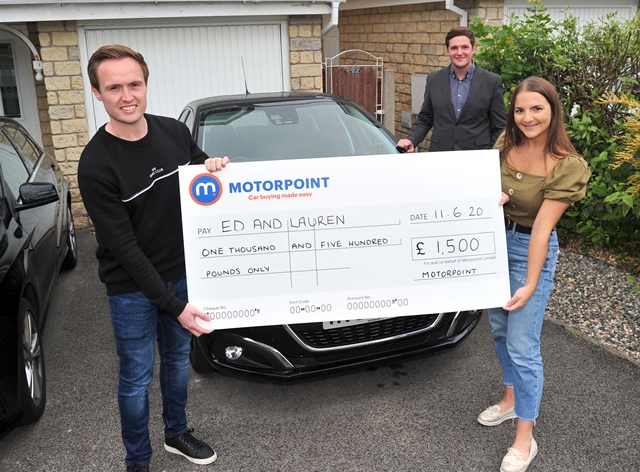 Ed Williams and Lauren Baron collect a cheque for £1,500 from Jordan Dean, General Manager of Motorpoint Burnley Ed Williams and Lauren Baron collect a cheque for £1,500 from Jordan Dean, General Manager of Motorpoint Burnley