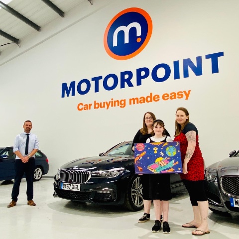 L-R Andrew Davies, General Sales Manager at Motoropoint Swansea with Sian, Cerys and Lois