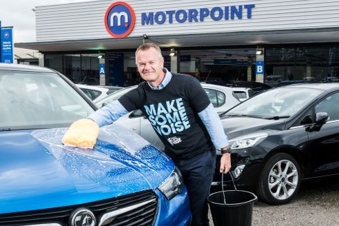 Motorpoint CEO Mark Carpenter puts in some cleaning practice ahead of company’s nationwide Charity Car Wash in early August