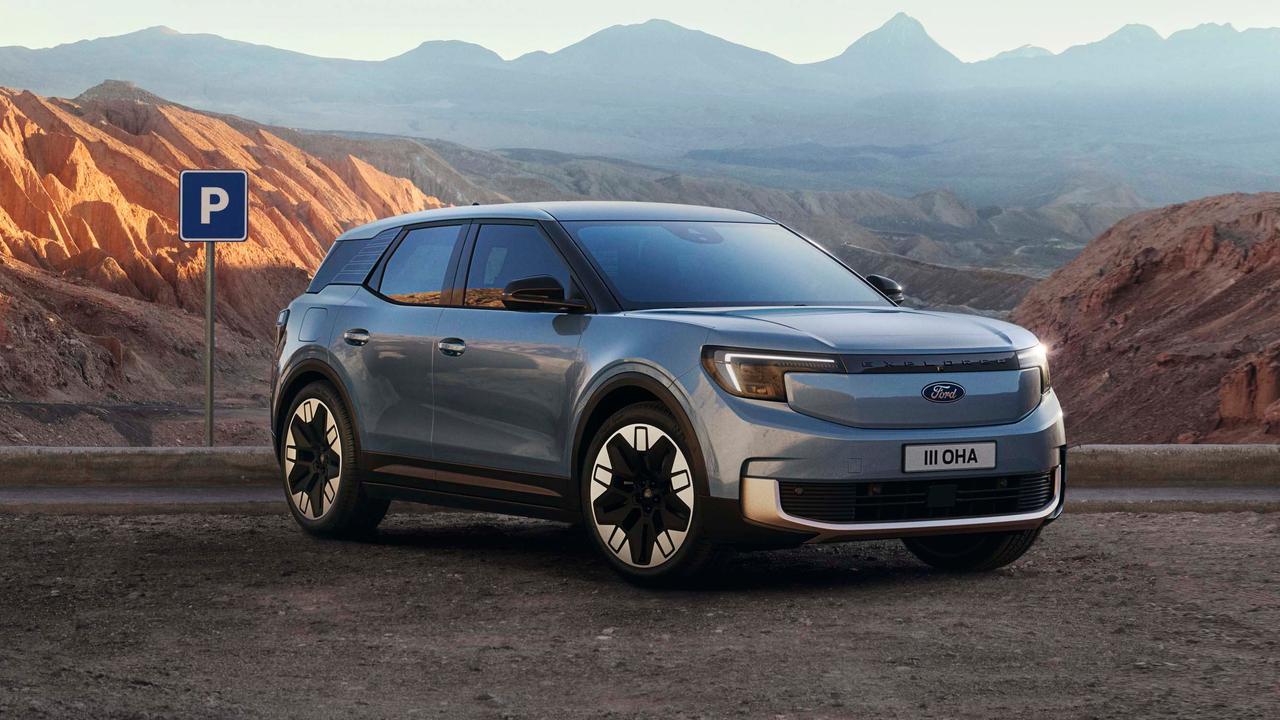Ford Explorer EV in front of mountainous landscape