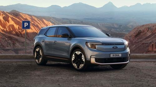 Ford Explorer EV in front of mountainous landscape