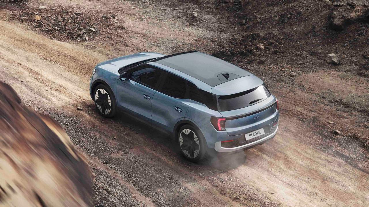 Ford Explorer driving off-road - top/rear view