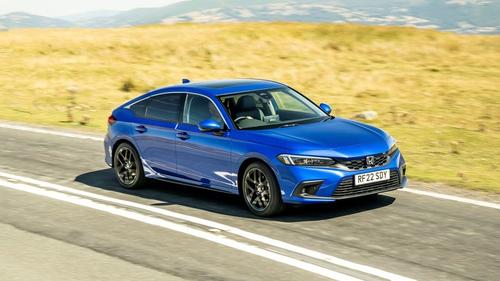 Blue Honda Civic driving