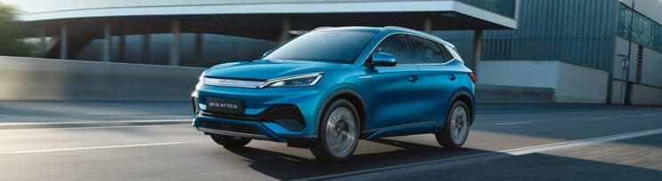 Blue BYD Atto 3 driving