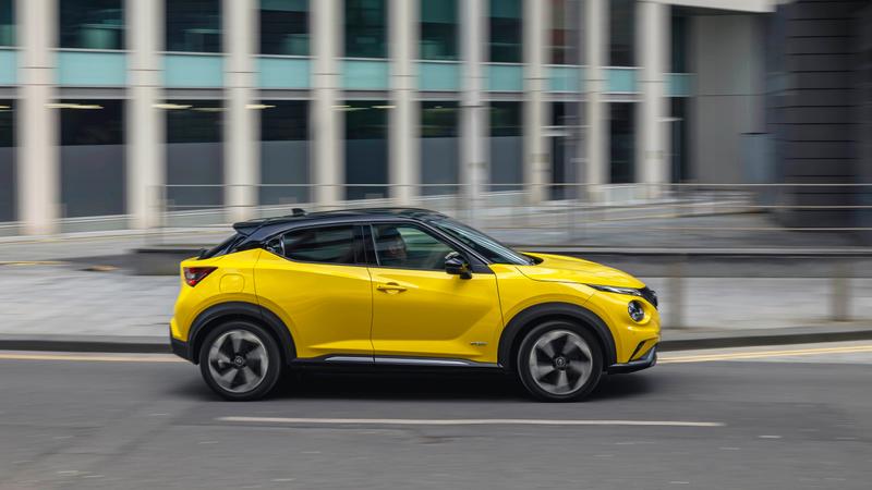 Yellow Nissan Juke driving side view