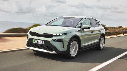 Green Skoda Elroq driving front view