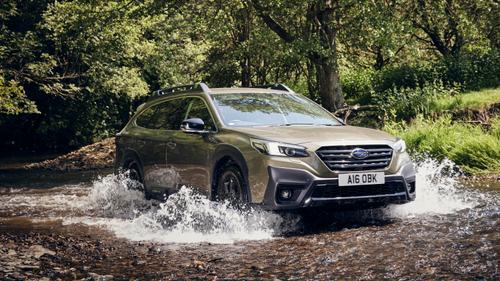 Subaru Outback driving through water