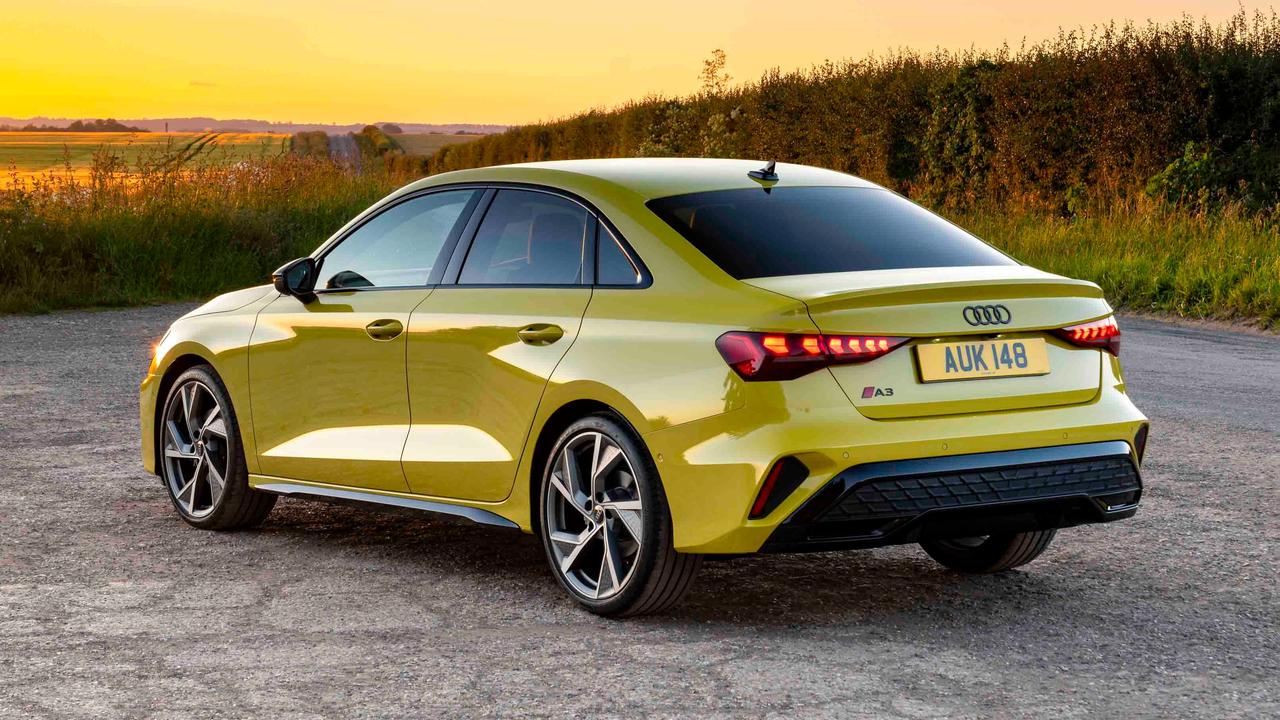Audi A3 saloon in yellow, rear view