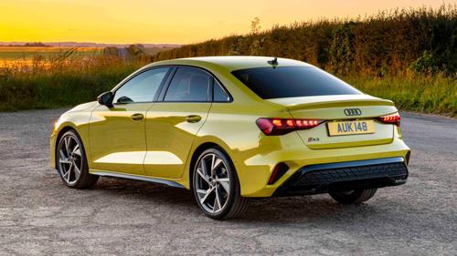 Audi A3 saloon in yellow, rear view