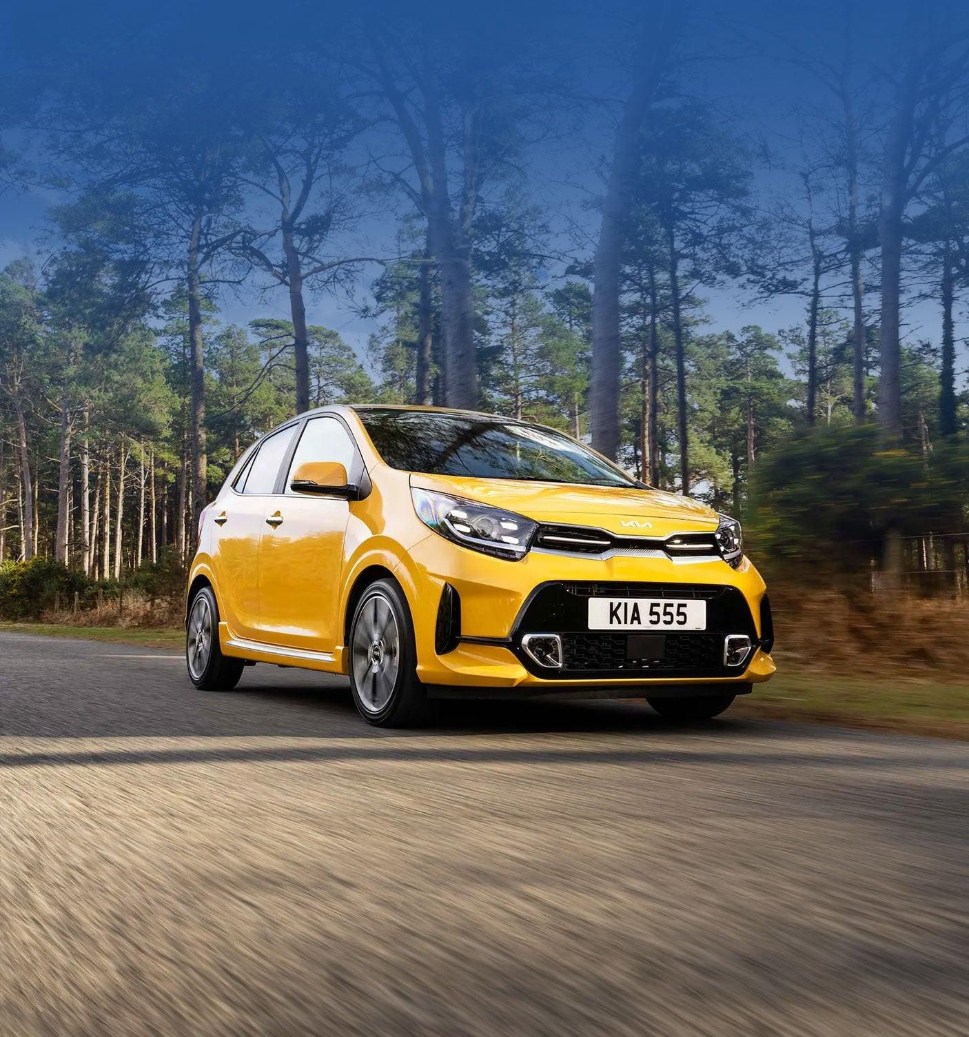 Yellow Kia Picanto driving