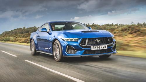 Blue 2025 Ford Mustang front driving shot, dynamic