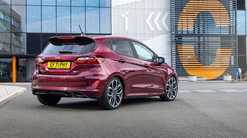Ford Fiesta in purple, static rear three quarter in a city