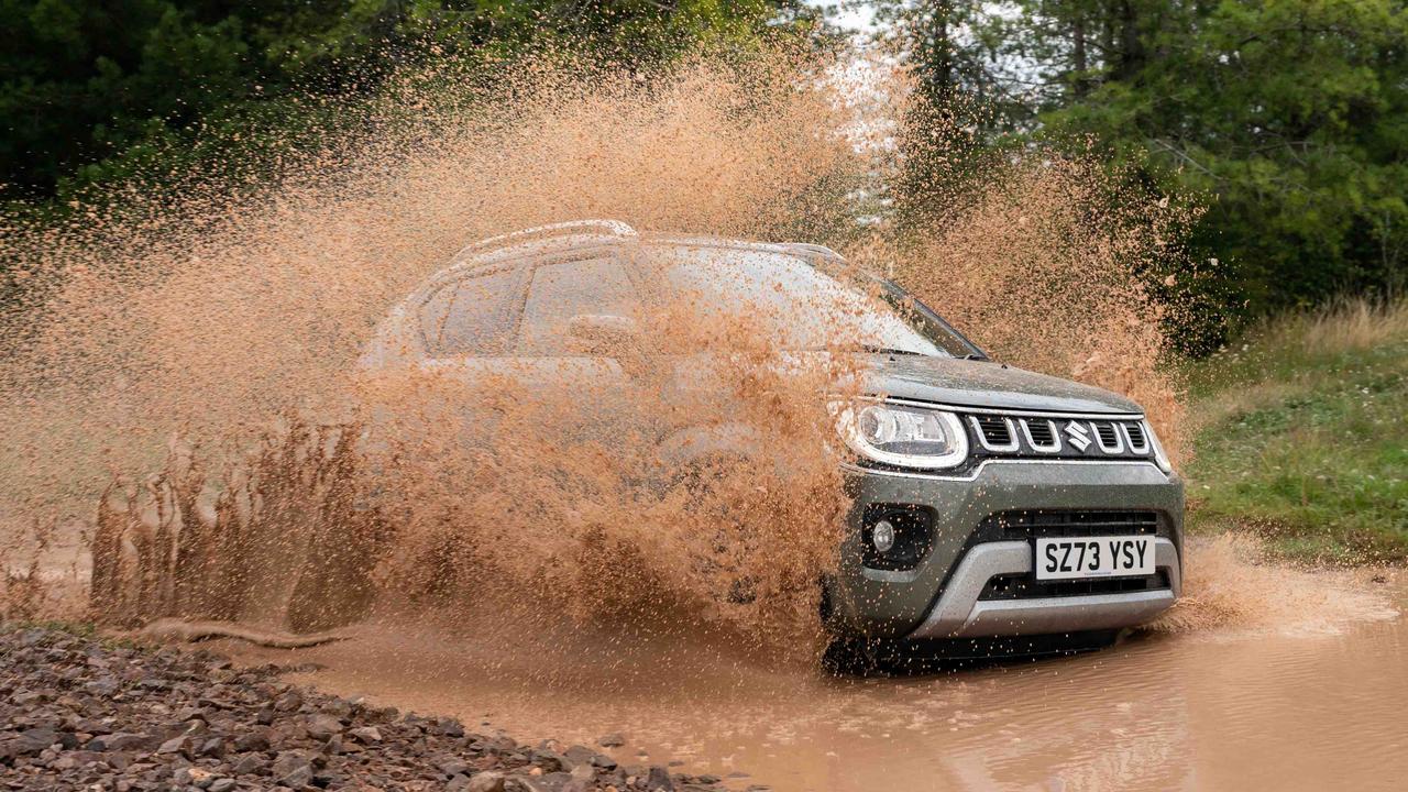Suzuki Ignis driving through muddy water
