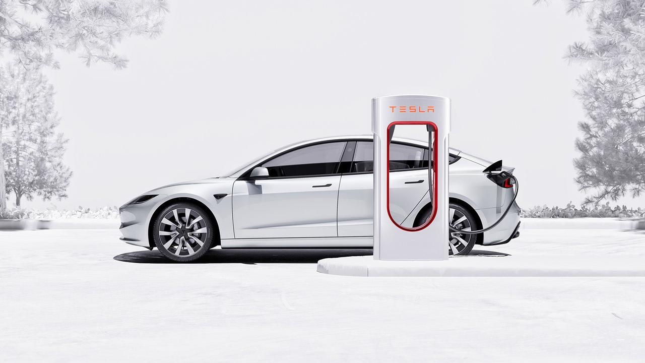 White Tesla supercharging
