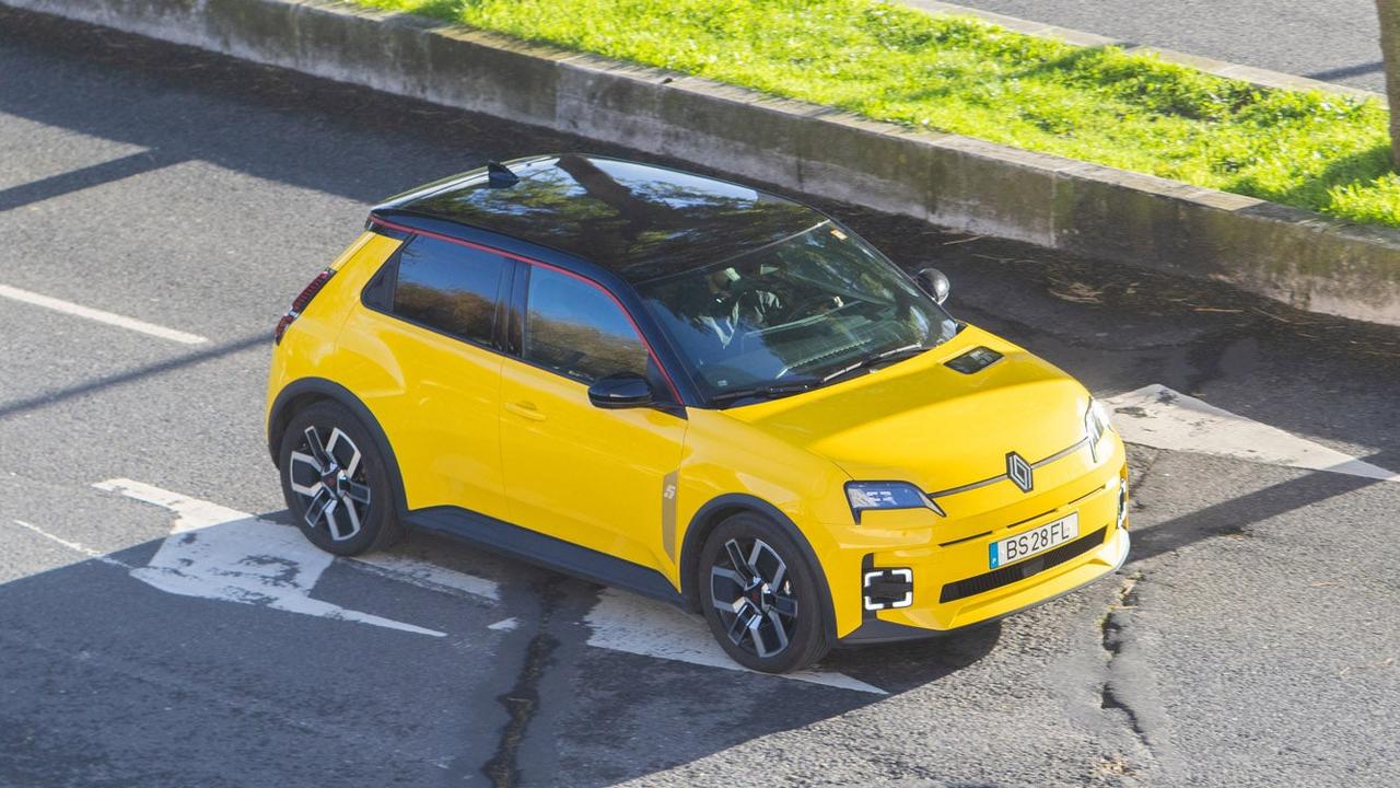 Yellow Renault 5 driving in Portugal
