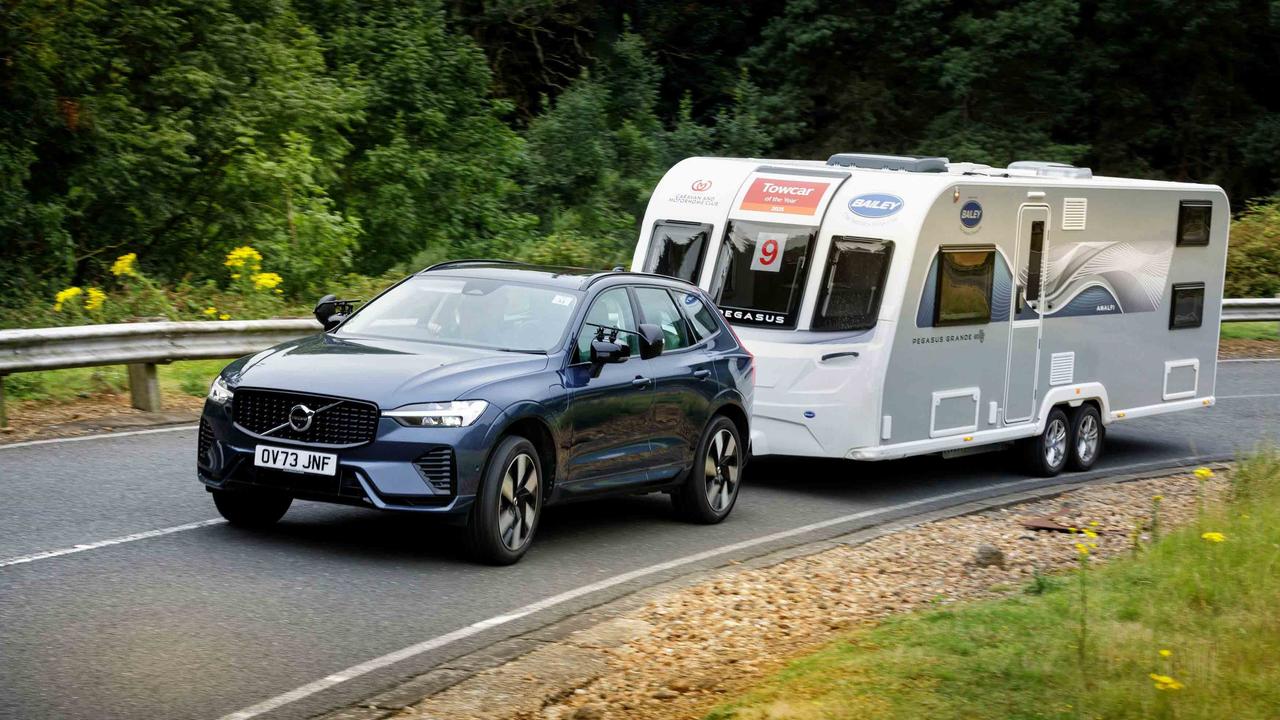 Volvo XC60 towing caravan up a hill