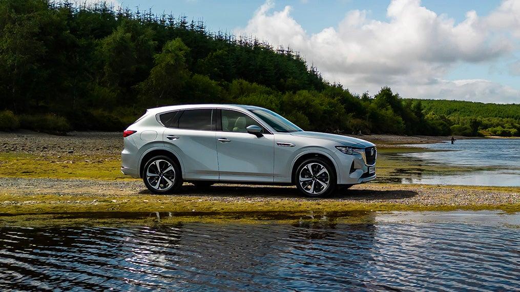 Mazda CX-60 parked by a lake