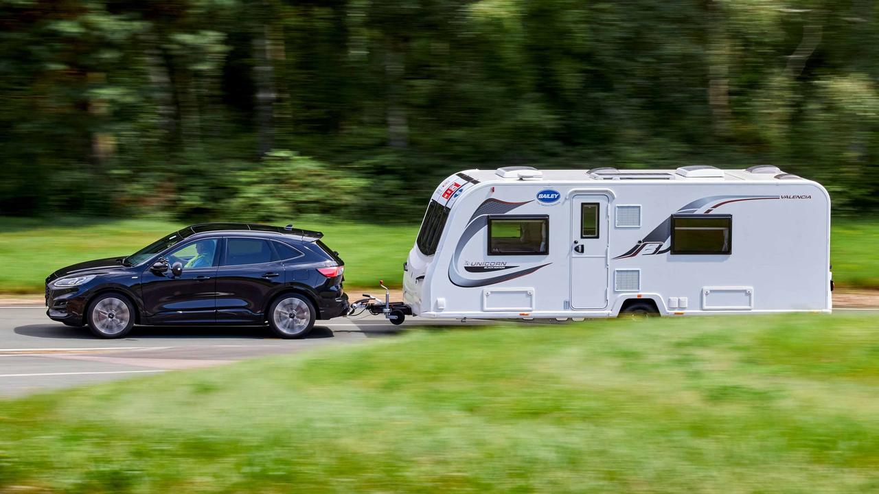 Ford Kuga towing a caravan, side view