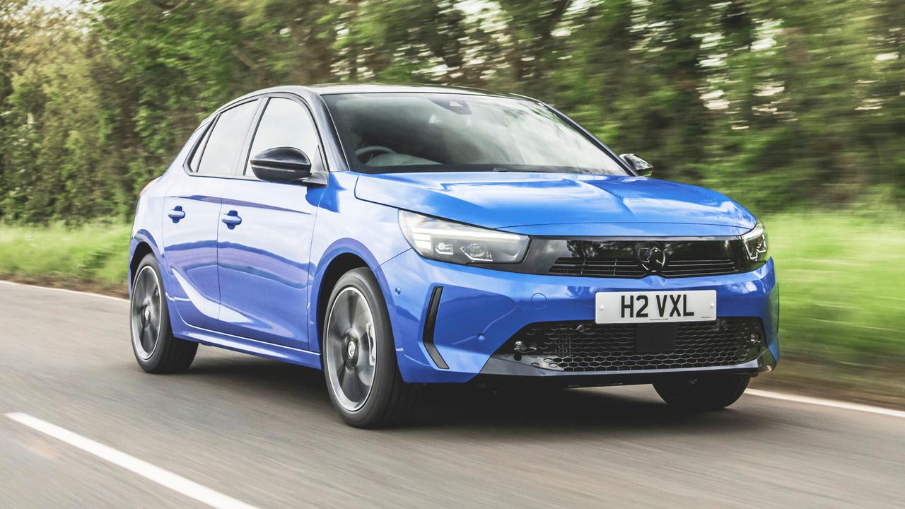 Blue Vauxhall Corsa driving
