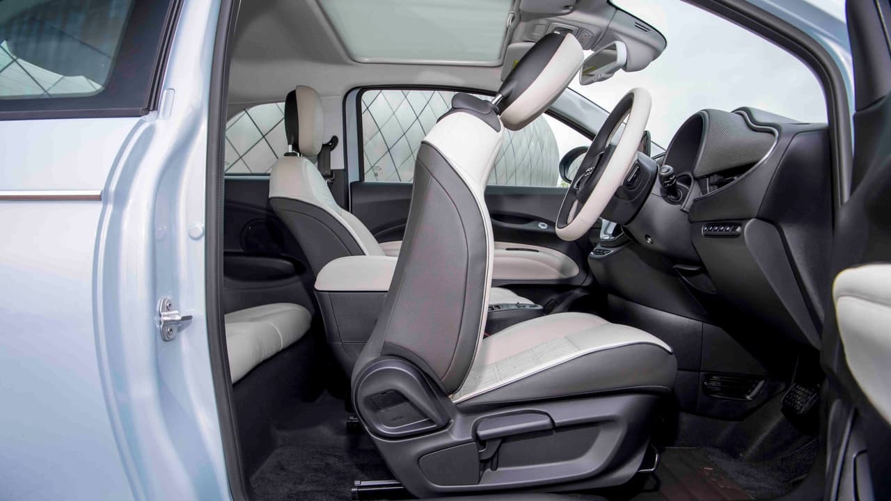 Fiat 500e driver's seat folded, side view