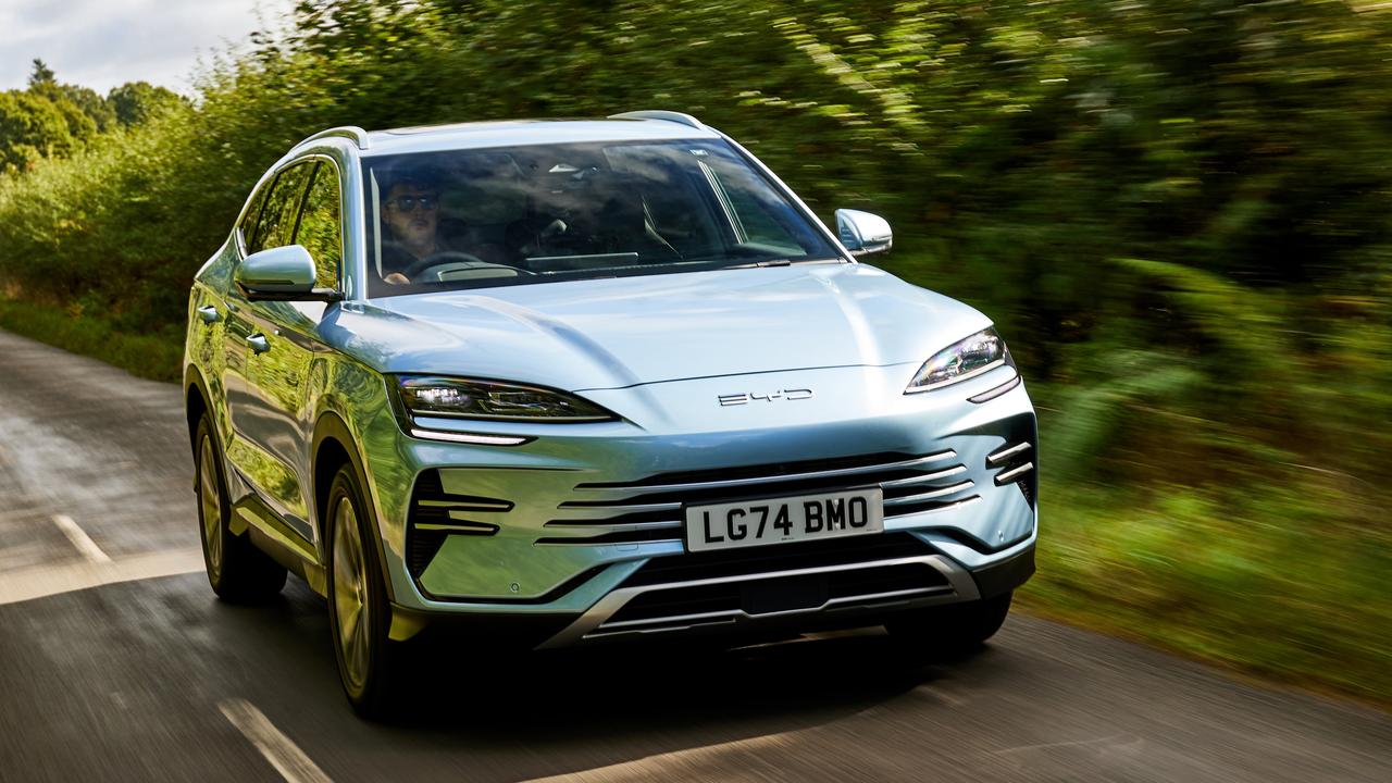 Blue BYD Seal U DM-i driving