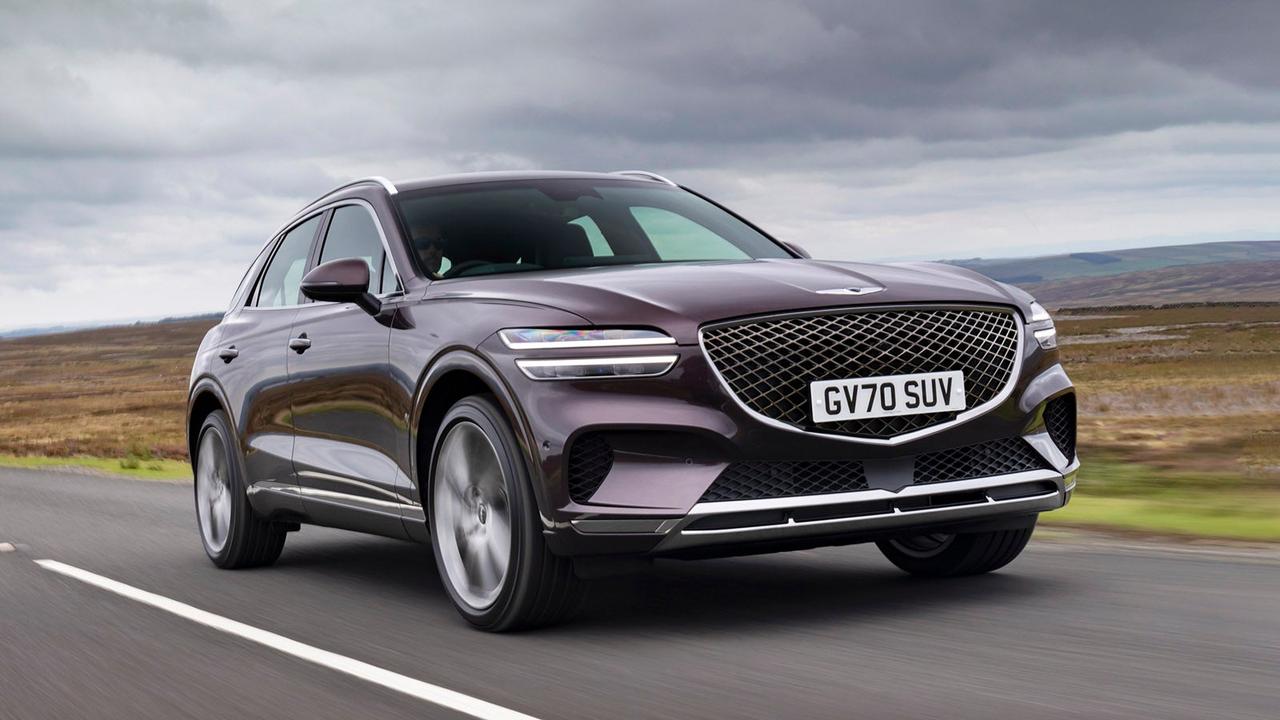 Genesis GV70 in purple, driving