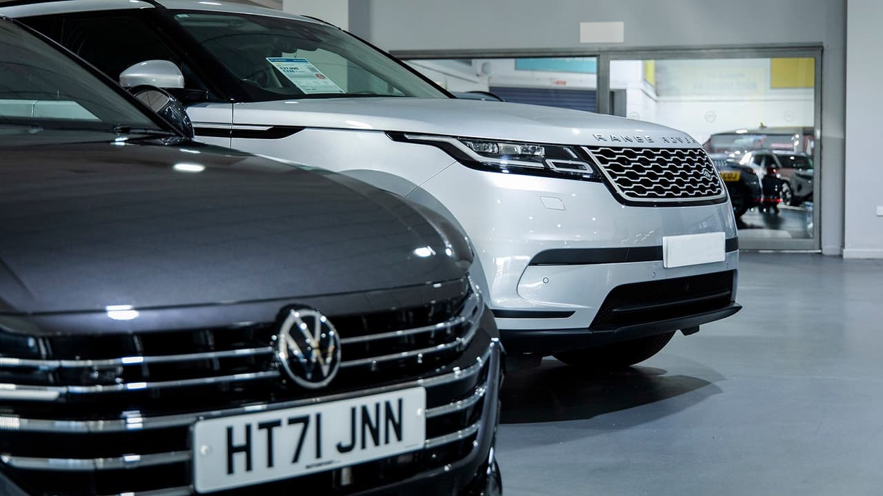 Volkswagen Arteon and Range Rover Velar at Motorpoint store