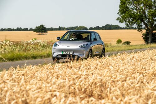 Geely EX2 driving front cornfield