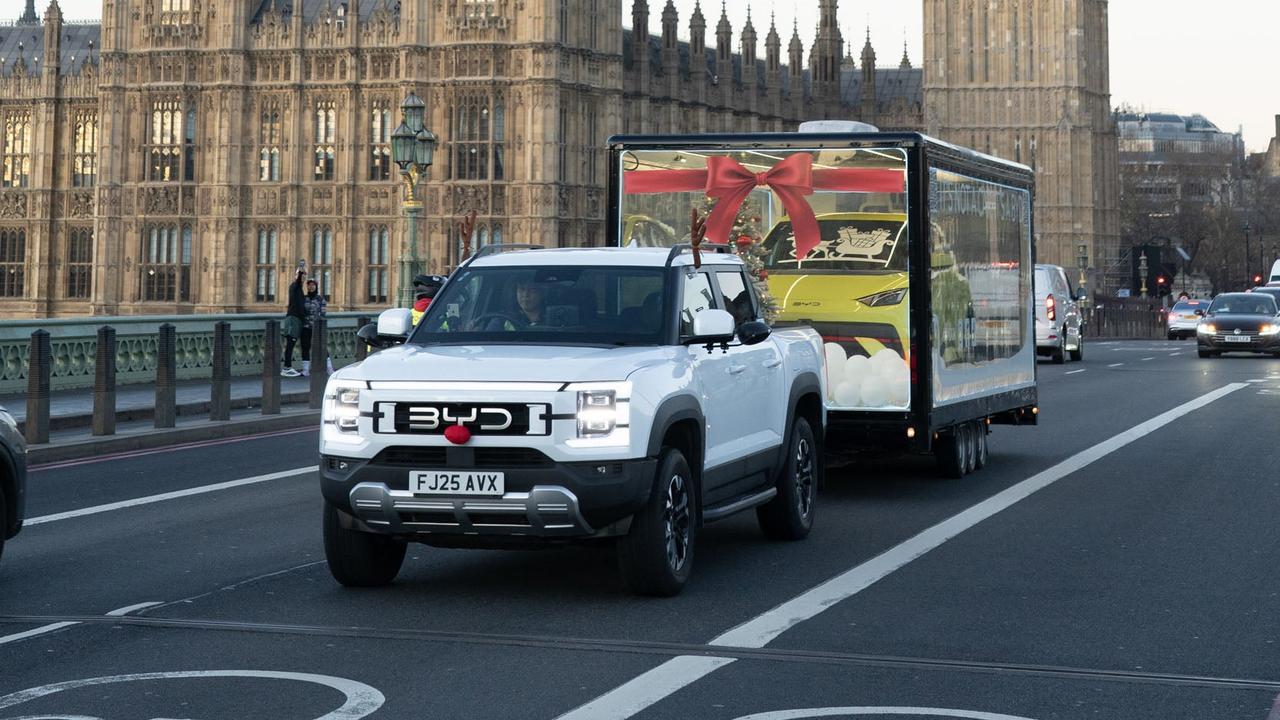 BYD Shark 6 towing Dolphin Surf through London