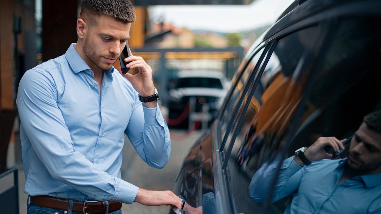 Man getting into car
