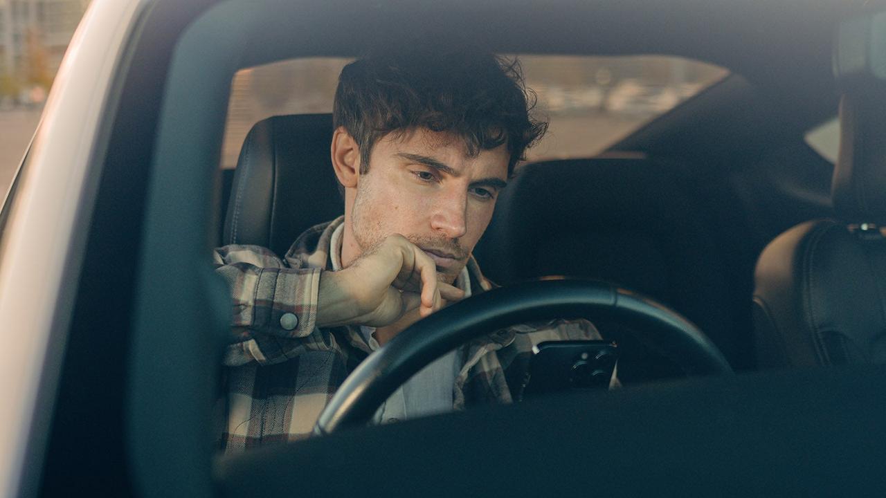 Driver thinking behind the wheel
