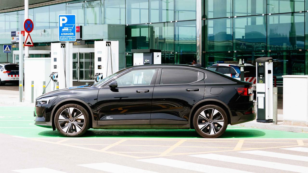 A Polestar 2 charging in Spain, side view