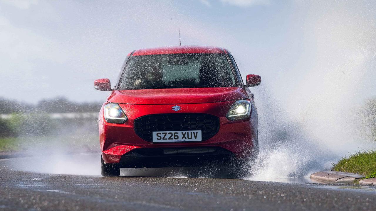 Suzuki Swift driving through puddle, front view
