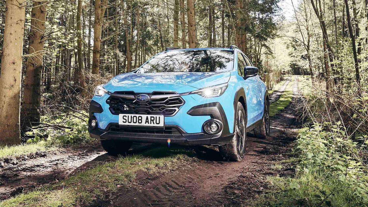 Subaru Crosstrek driving through forest
