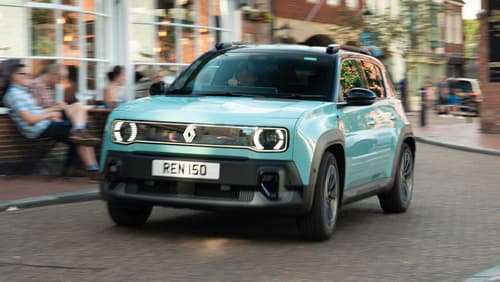 Renault 4 driving through town