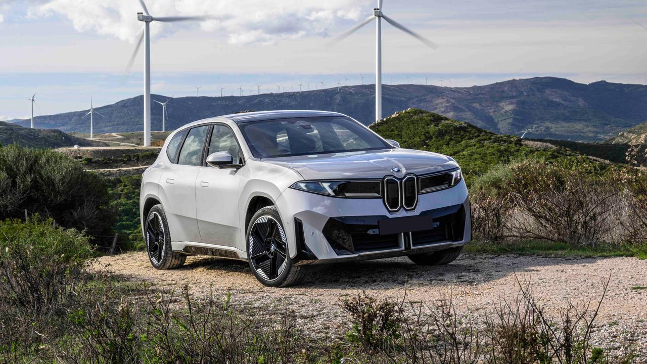 BMW iX3 'Neue Klasse' in front of windmills