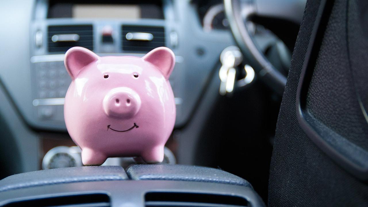 Piggy bank on car's centre console