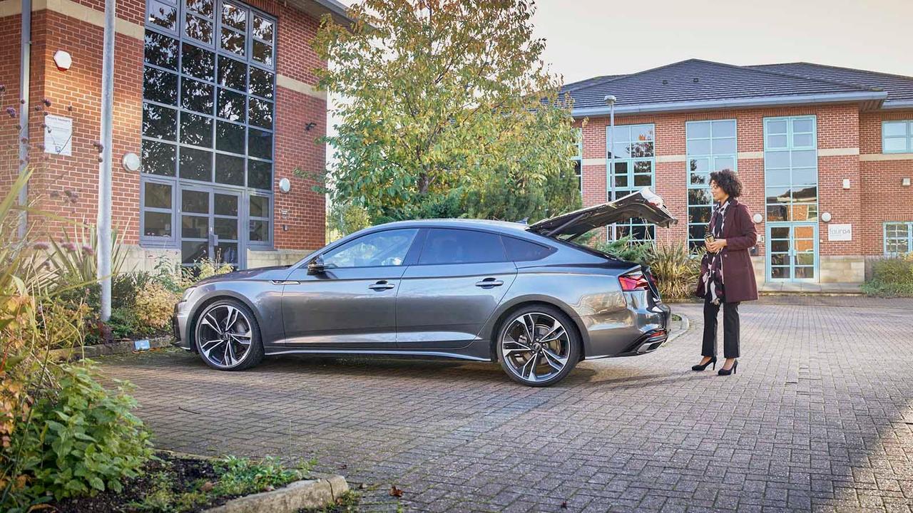 Driver opening car boot
