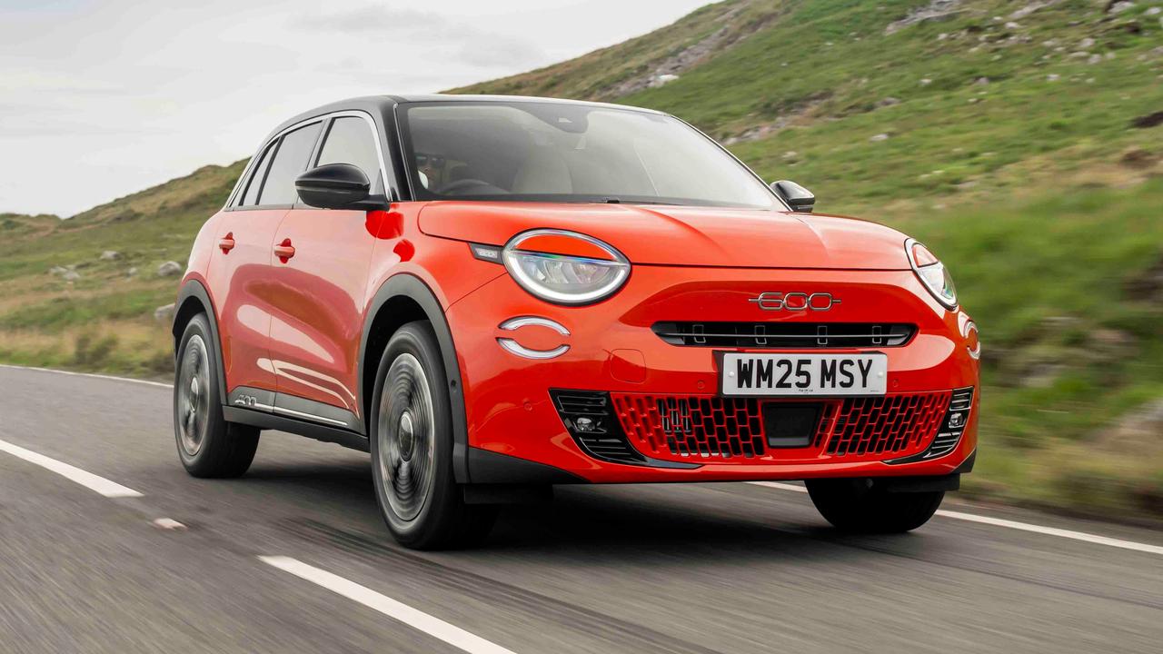 Orange Fiat 600 driving