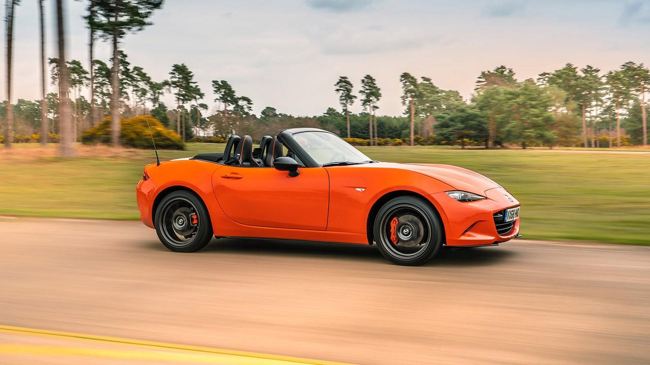 Mazda MX-5 in orange, side shot