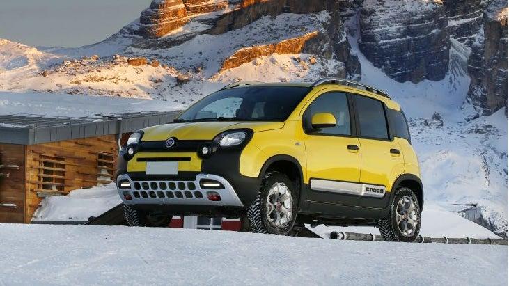Yellow Fiat Panda Cross parked in ski resort