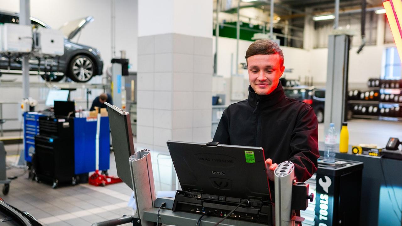 Person doing car diagnostic