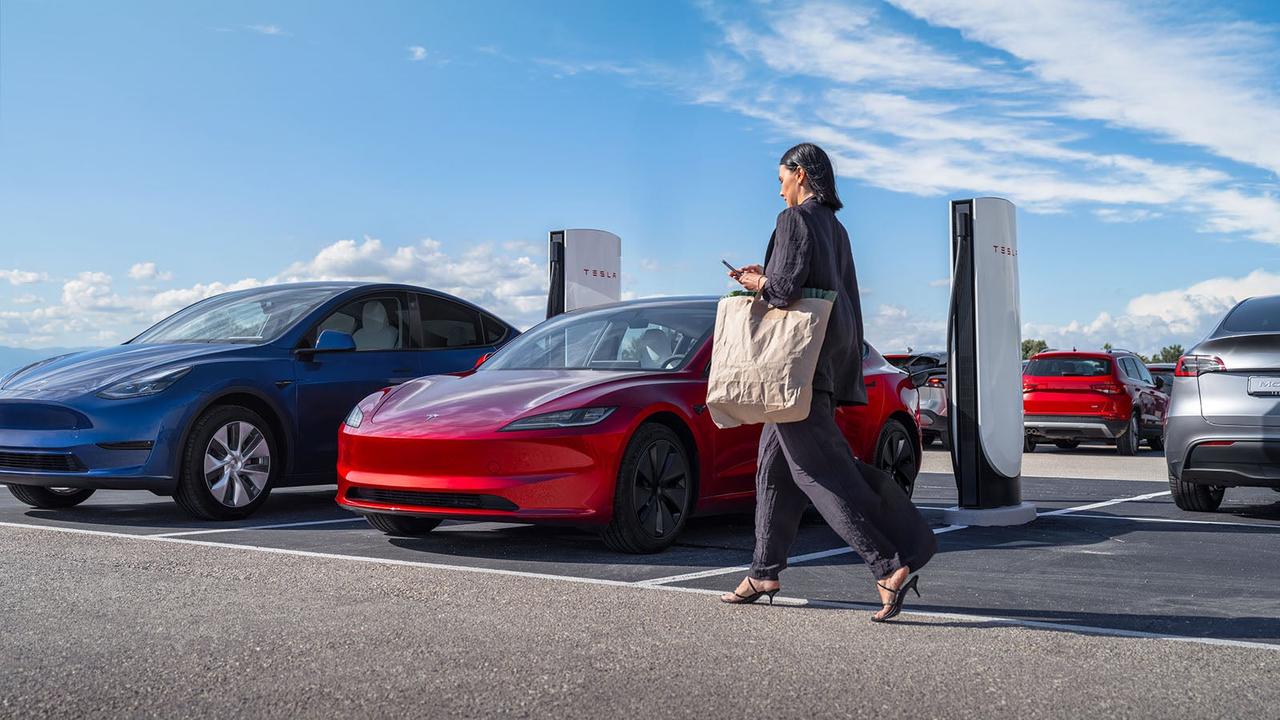 Shopper walking to Tesla car