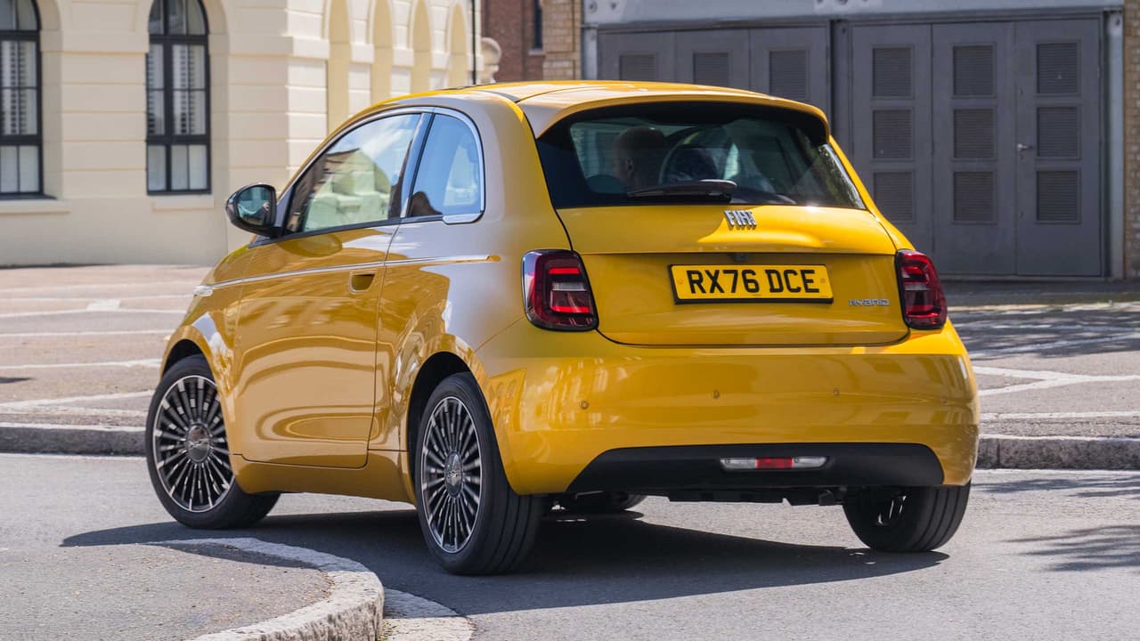 Fiat 500 Hybrid driving in city, rear view