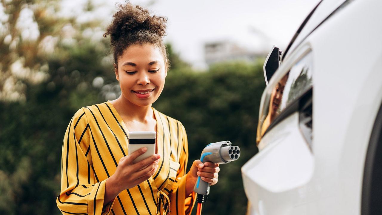 Driver paying for EV charging