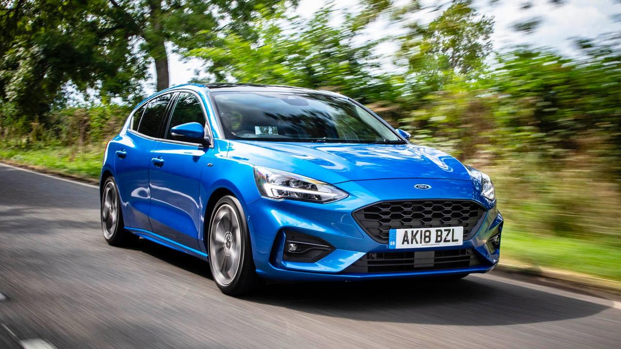 Blue Ford Focus driving