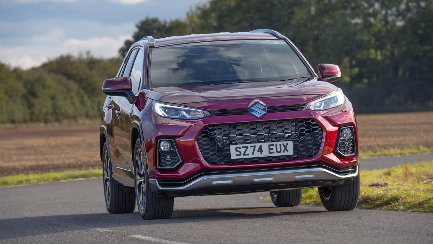 Red Suzuki Across driving