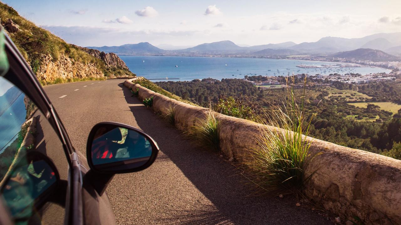 Car driving towards coast in Spain