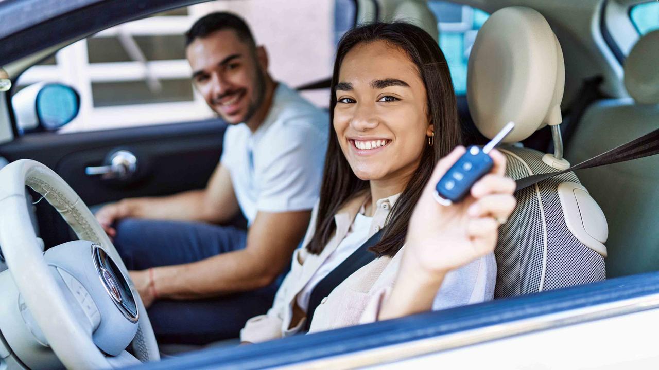 Young Spanish couple in a Fiat 500